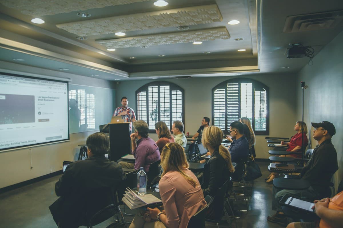 Instructor teaching a group of adults in a workshop